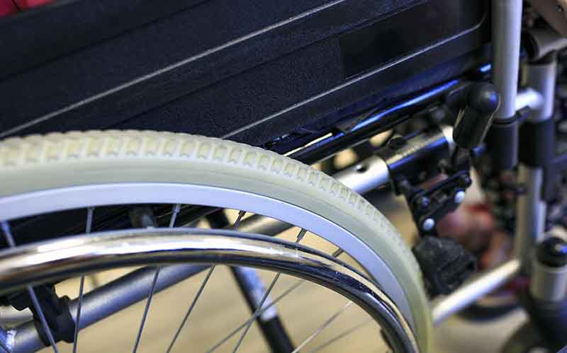 Detail of a wheel of a used wheelchair