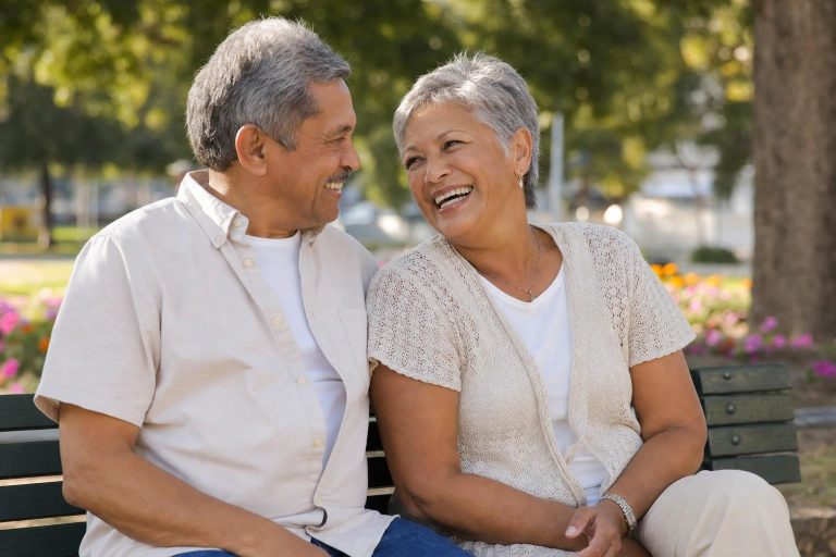 Happy older couple enjoying a sunny park